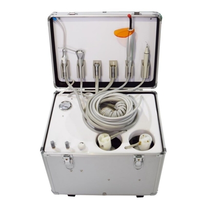 Valija de tratamiento dental de tamaño pequeño con luz curativa incorporada y una unidad móvil de tratamiento dental.